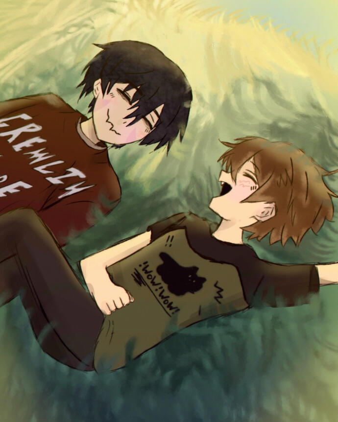 laying in the grass together
